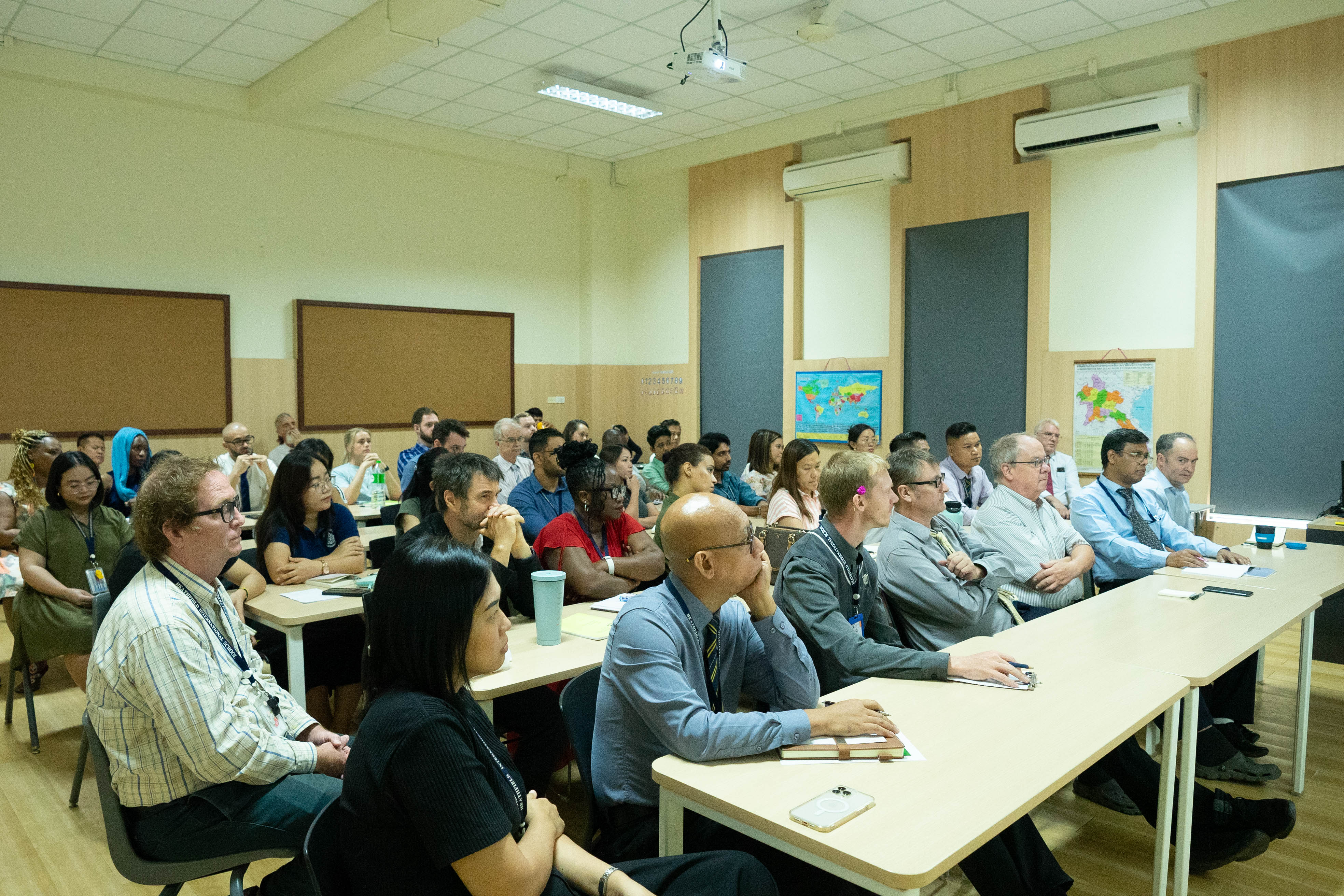 Students and teacher around a globe